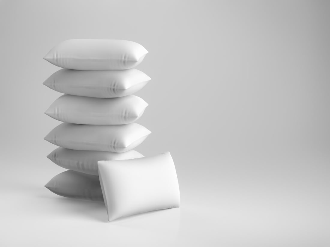 Pile of Soft White Pillows